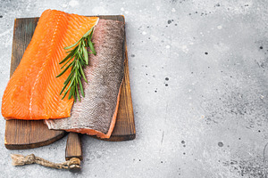 Fresh raw salmon fillet seafood ingredient with herbs and lemon, a Food & Drink Photo by composter-box@mail.ru