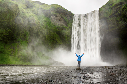 Man near waterfall containing iceland, nature, and water, a Nature Photo by Nature and travel