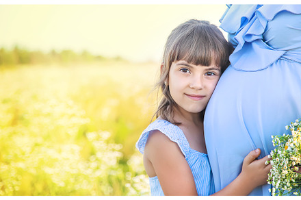 pregnant woman with daughter in a, a Person Photo by yanadjana