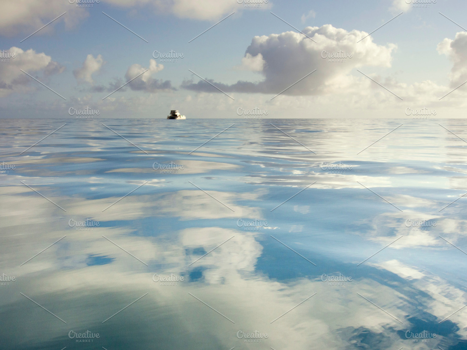 Sky reflecting in still ocean, a Nature Photo by Zepol
