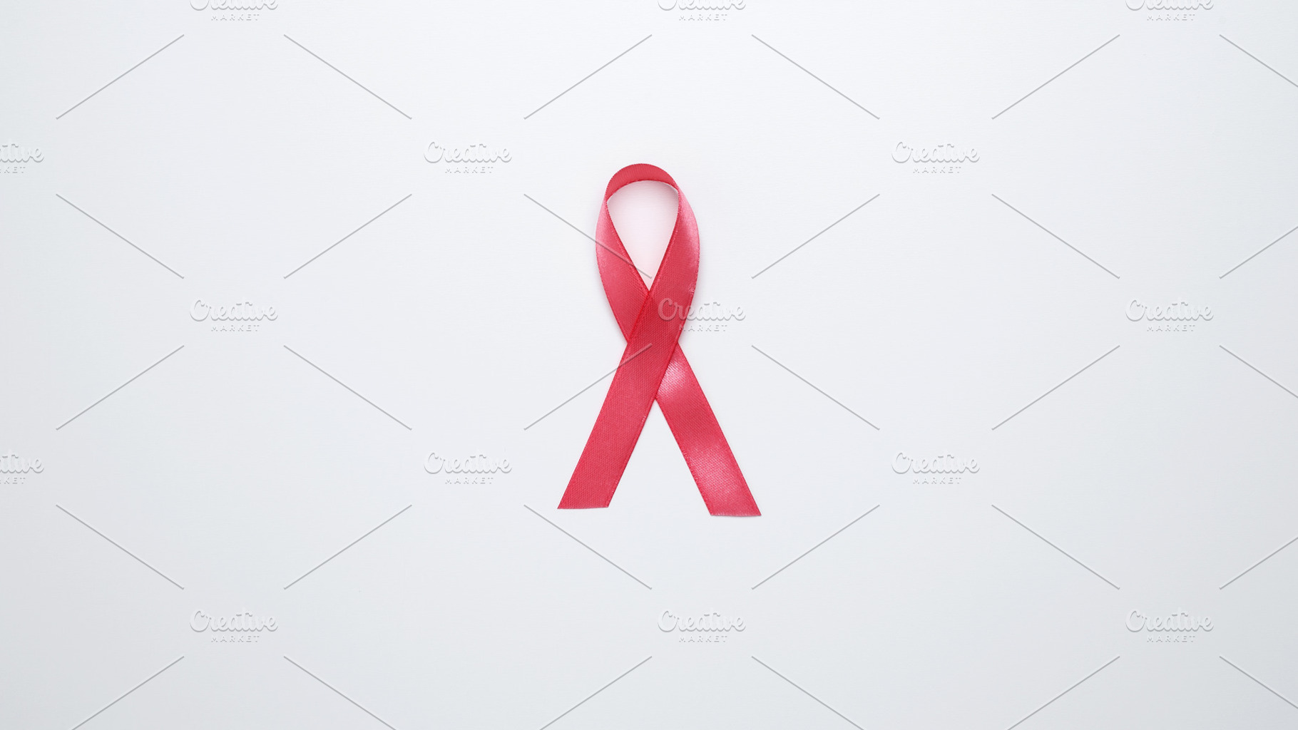 Pink ribbon representing awareness and prevention of breast cancer, a Photo by matucha