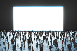 People watch big white screen.