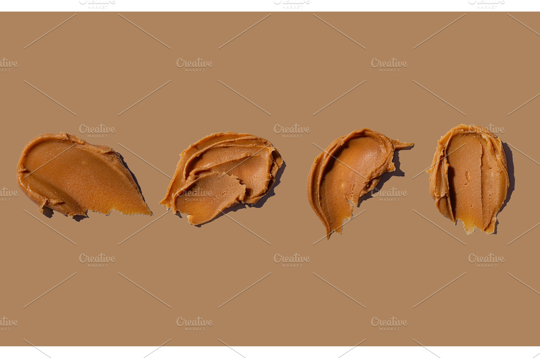 Smear of fresh peanut butter texture, a Food & Drink Photo by Yulia Furman