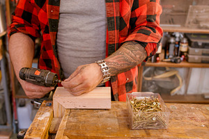 Joiner occupation drilling wood, a Person Photo by Photo Drive Studio