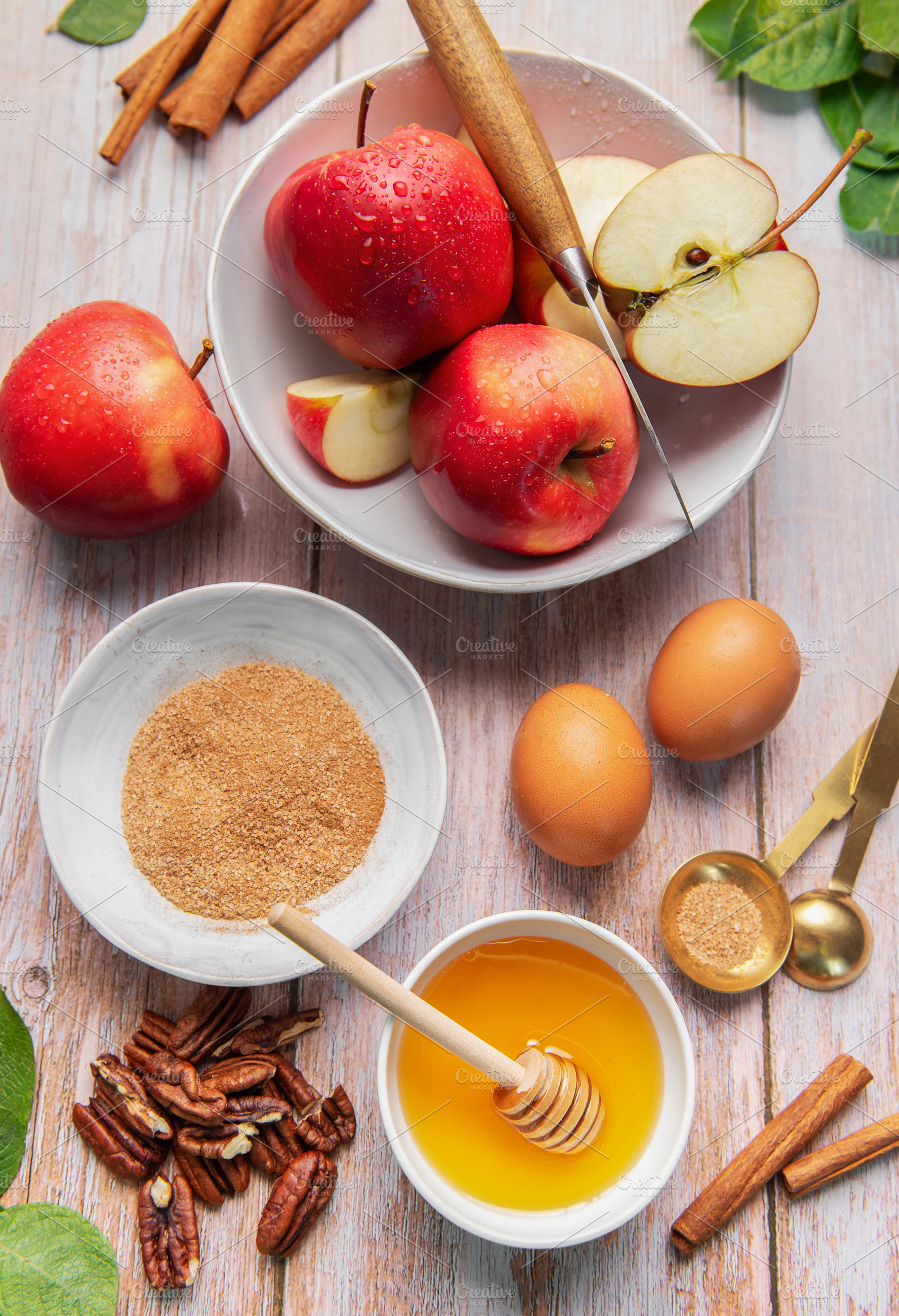 Baking ingredients for apple dessert on wooden table, a Food & Drink Photo by Olena Rudo