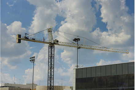 High rise building construction with, an Industrial Photo by Ungvar Studio