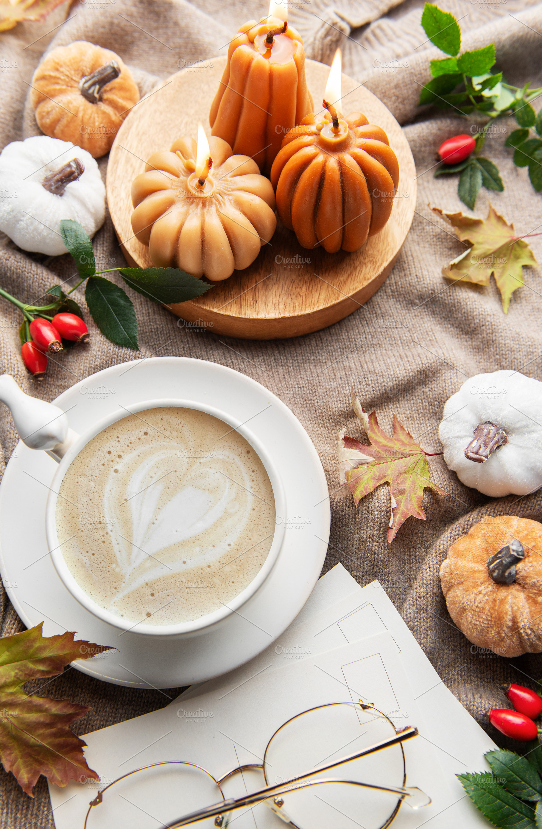 Autumn hygge flat lay with coffee and pumpkin candles, a Holiday Photo by Olena Rudo