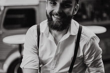 Young bearded man in a cafe, a Person Photo by EVA.studio