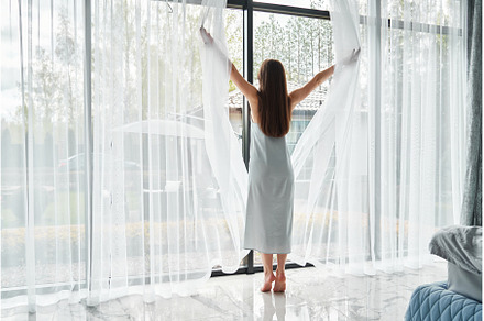 Young woman stand and open white