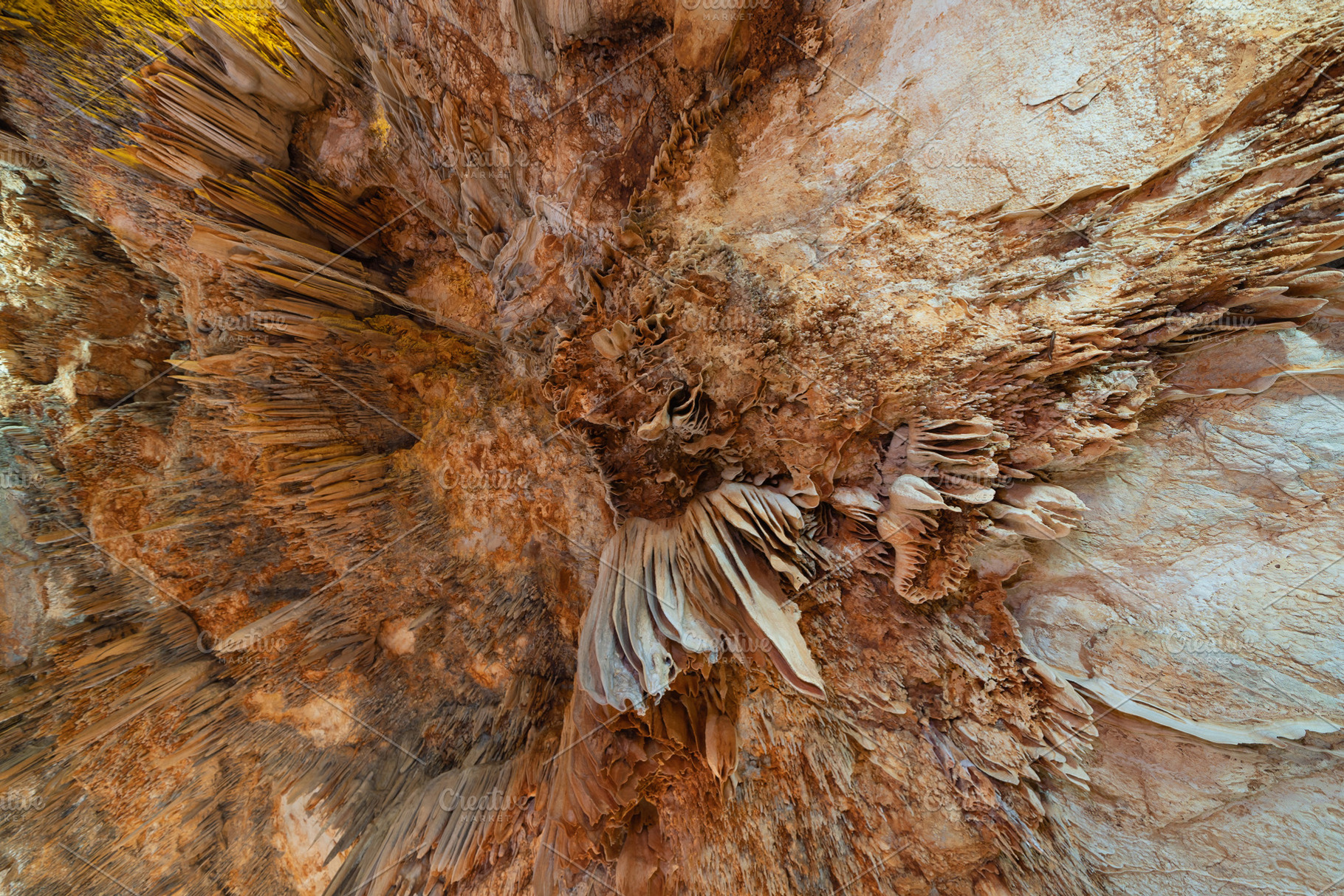 Natural stalactite and stalagmite rock stone cliff hang from cav, a Background Photo by Tampatra