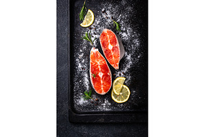 Raw uncooked salmon with rosemary, a Food & Drink Photo by Yulia Furman