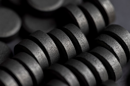 Open and unpacked tablets of black color close-up, a Background Photo by MyPhotos