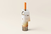 Wine bottle with a tag mockup, a Packaging Mockup by MockupFree.Net (Thumbnail 1 of 5)