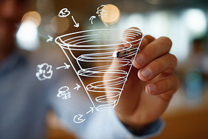 Sales funnel diagram drawn on a window during a business strategy session in a, a Photo by AlyaAnd