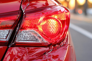 Damaged car tail light close-up, a Transportation Photo by AlyaAnd