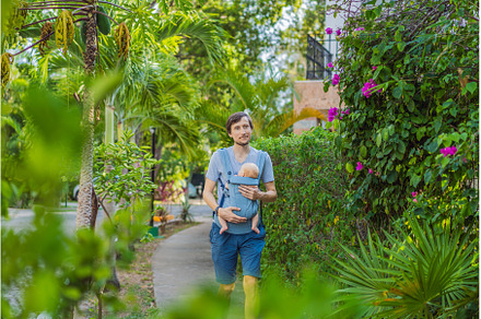 Young father walks in nature with