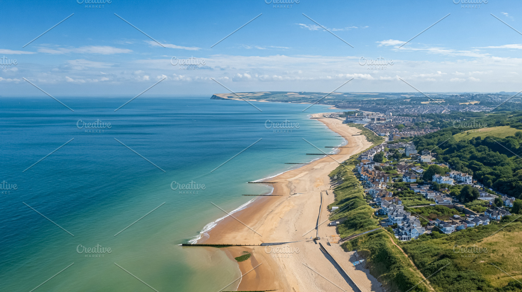 Bournemouth coastline aerial view showing golden sand beach, tur, a Photo by Studio ANNA