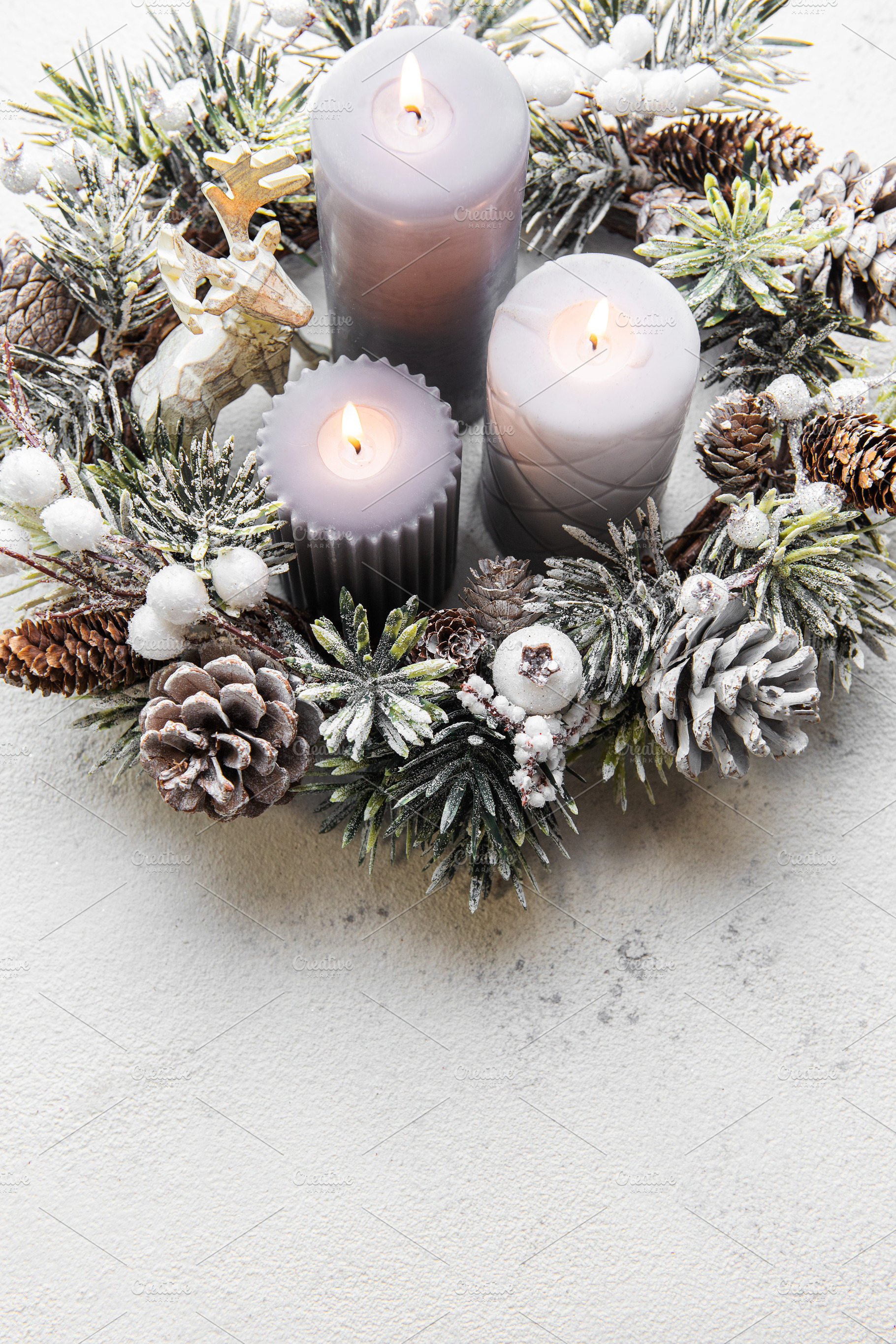 Decorated Advent wreath from fir and evergreen branches with  bu, a Holiday Photo by Olena Rudo
