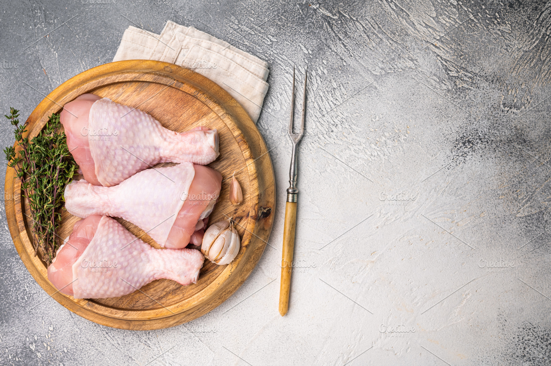 Raw poultry drumsticks, chicken legs ready for cooking with herb, a Food & Drink Photo by composter-box@mail.ru