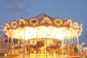 Vintage carousel containing carousel, amusement, and park