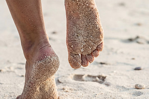Sandy Bare Feet on Summer Beach, a Person Photo by Virgo Studio
