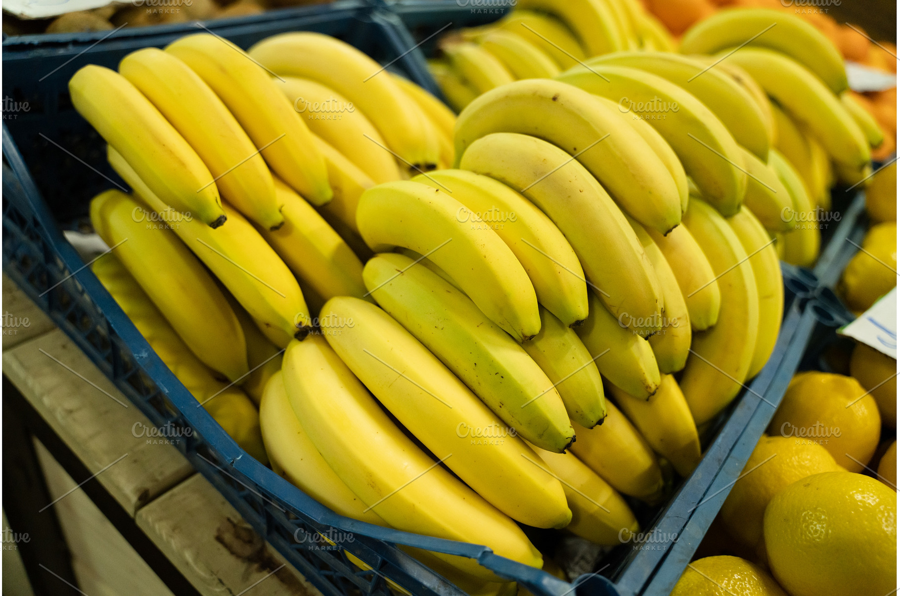 Fresh bananas in plastic boxes on, a Food & Drink Photo by oksix