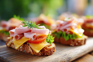 Delicious ham sandwiches with layers of fresh ingredients on rustic wooden boar, a Food & Drink Photo by AlyaAnd