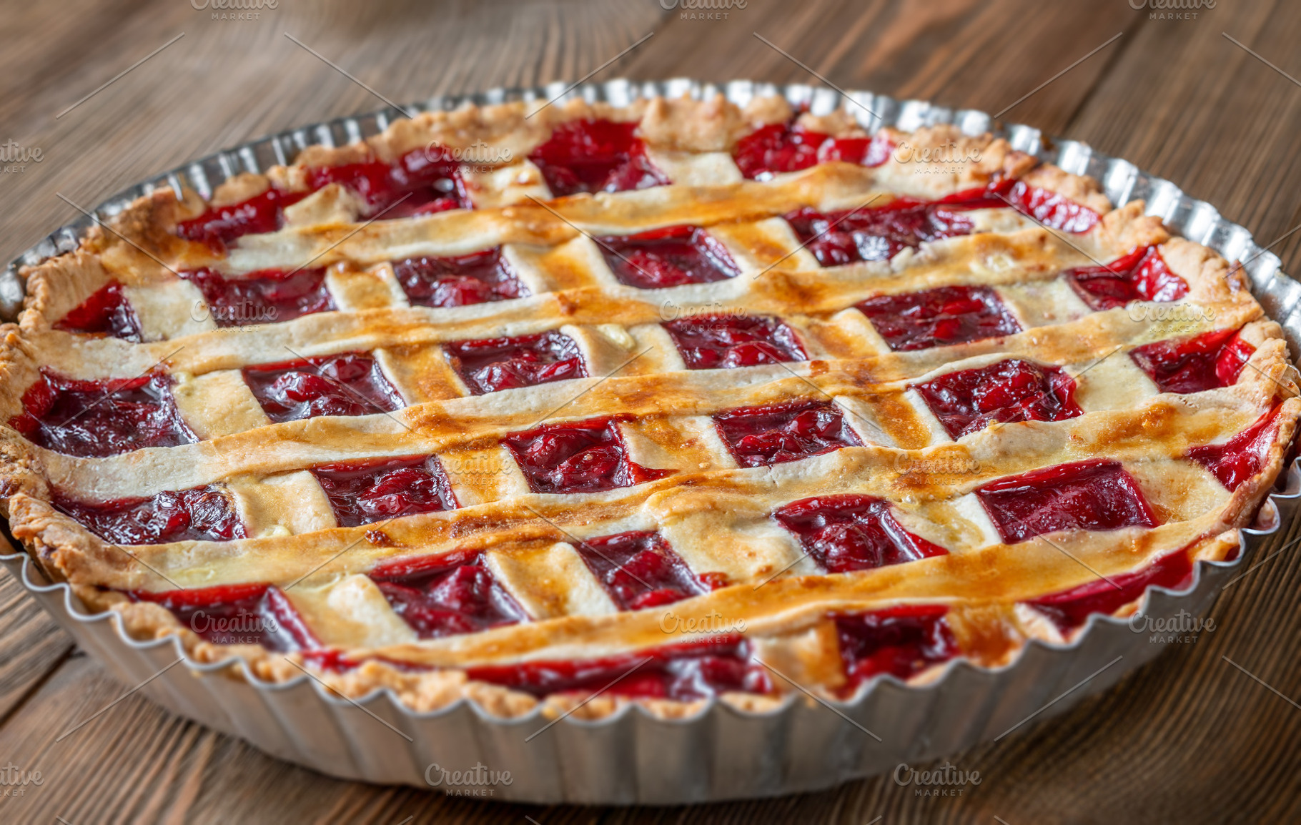 Freshly baked lattice-top cherry pie, a Food & Drink Photo by Alexander Prokopenko