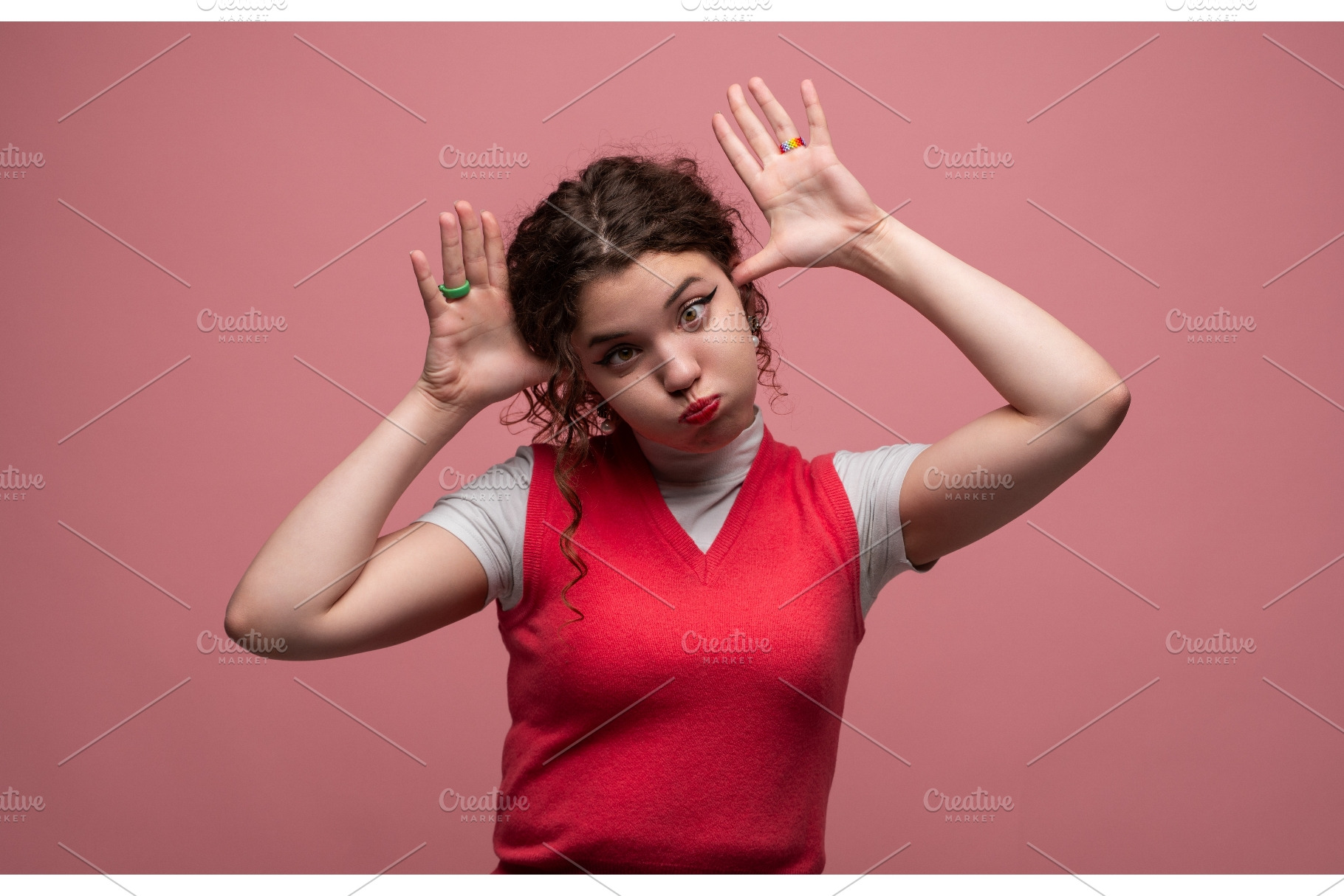 Young woman making a playful grimace, a Person Photo by volodymyrshtun13795