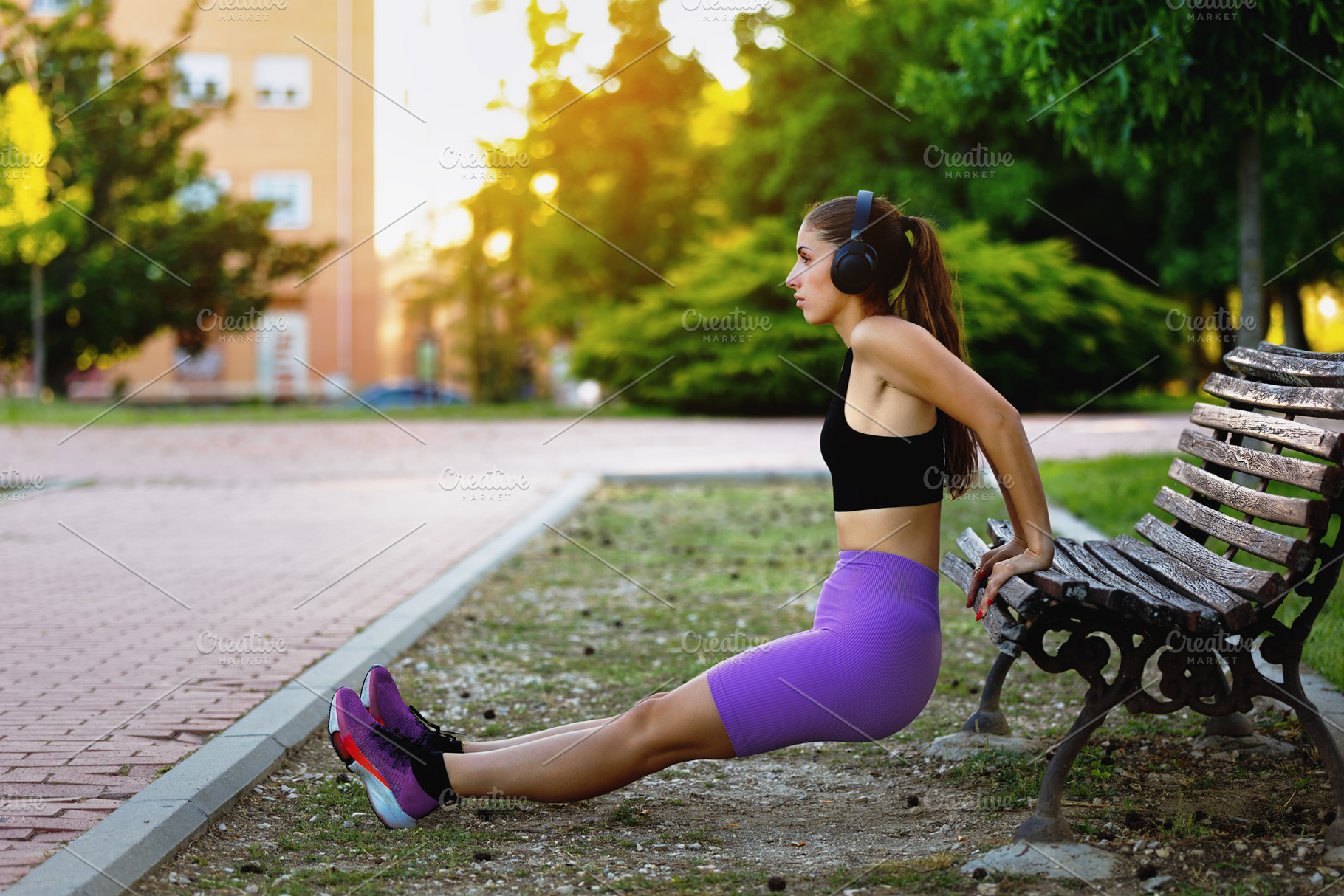 Young woman exercising on a park ben, a Sports & Recreation Photo by Perpis