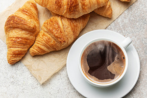 Freshly baked croissants and steaming cup of coffee creating per, a Food & Drink Photo by Olena Rudo