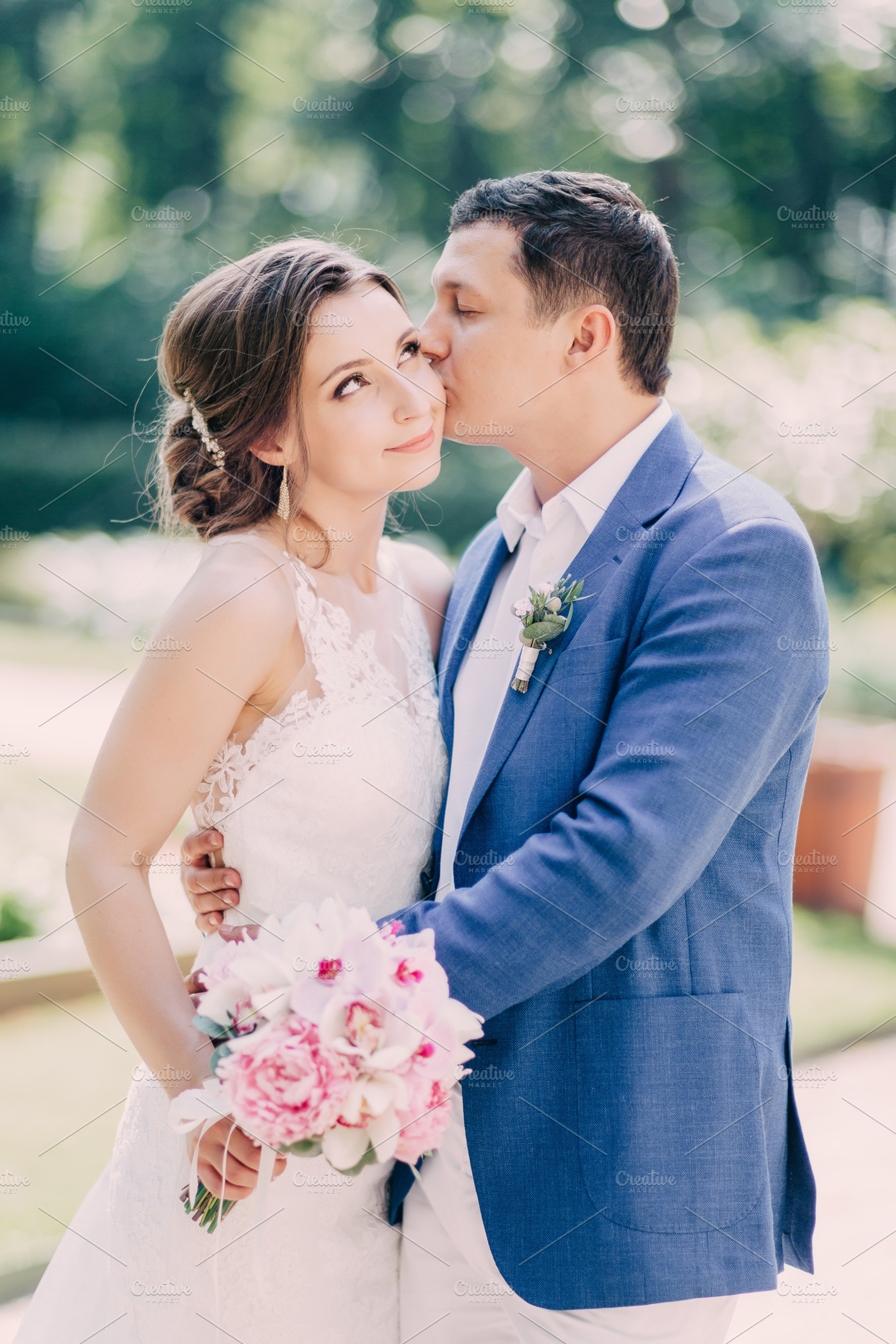 Groom kisses the Bride, a Person Photo by DesignLab