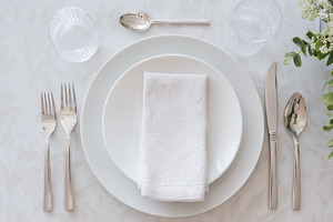 Elegant table setting for a special event, showcasing formal fin, a Photo by Studio ANNA