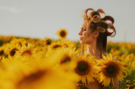 woman in a field of sunflowers