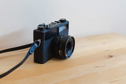 Vintage camera on a wooden table, a Technology Photo by OSORIOartist