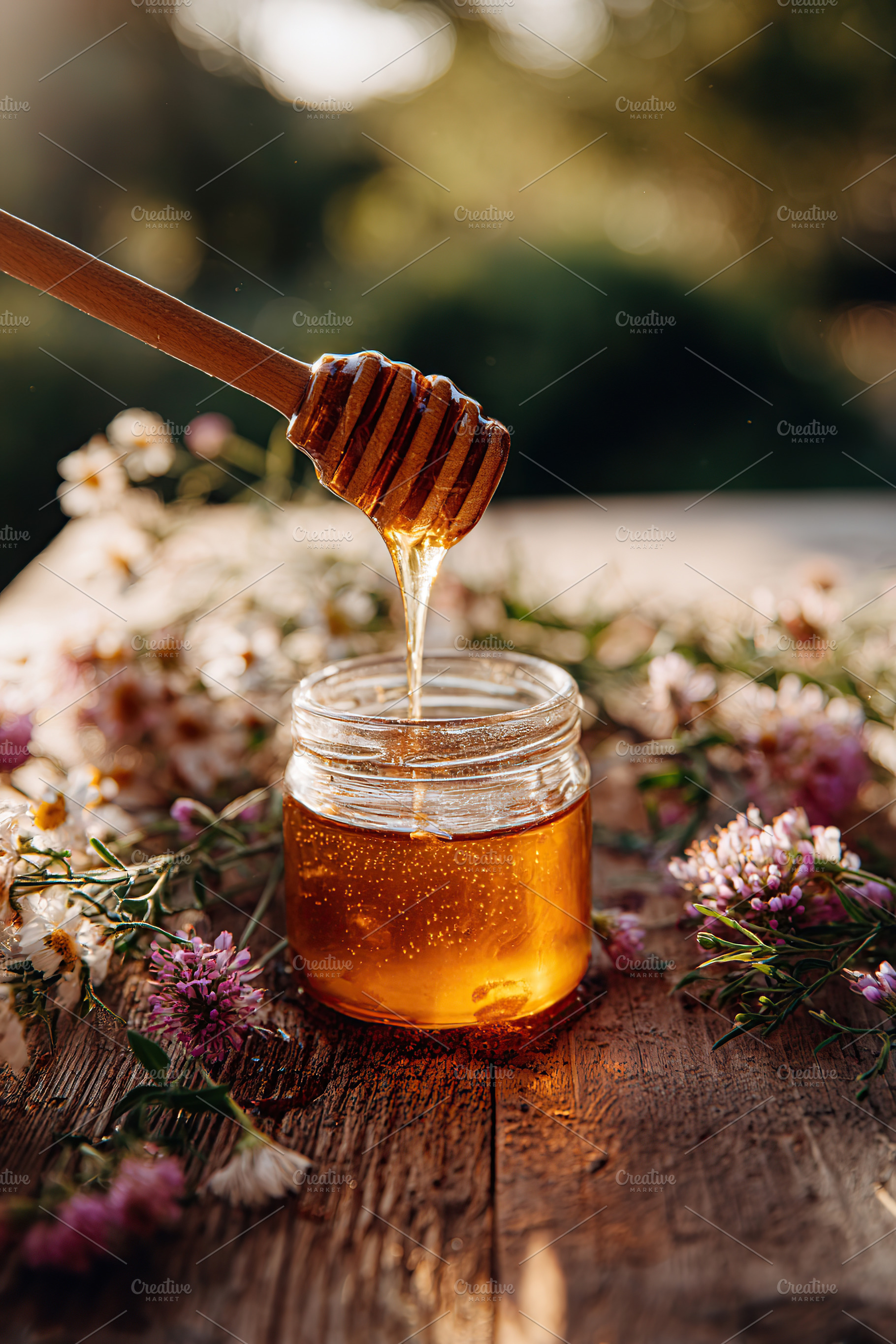 Close-up of a small glass jar filled with golden honey and wooden dipper on a r, a Food & Drink Photo by AlyaAnd