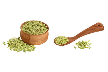 Dried fennel seeds in wooden bowl, a Food & Drink Photo by NataPhoto