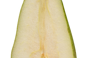 Half of a ripe green pear in a cross section with visible pit an, a Food & Drink Photo by ndanko