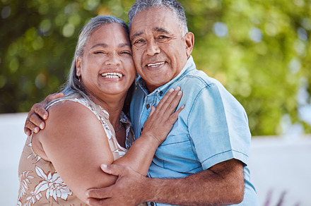 Love, senior couple and hug with smile, happy and bonding to celebrate, relationship, marriage and being romantic together. Portrait, mature man and woman hold each other, being loving or for romance, a Photo by Peopleimages.com