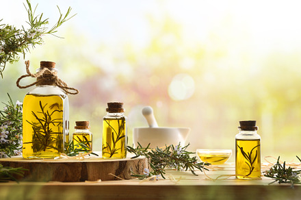 Homemade rosemary oil extract in glass jars in nature, a Health & Medical Photo by Davizro's Market