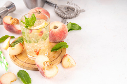 Flat chinese peach and lime lemonade, mojito cocktail