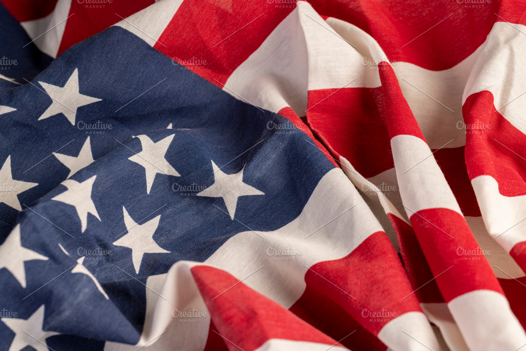 part of the American flag with stars and red and white stripes, a Photo by MyPhotos