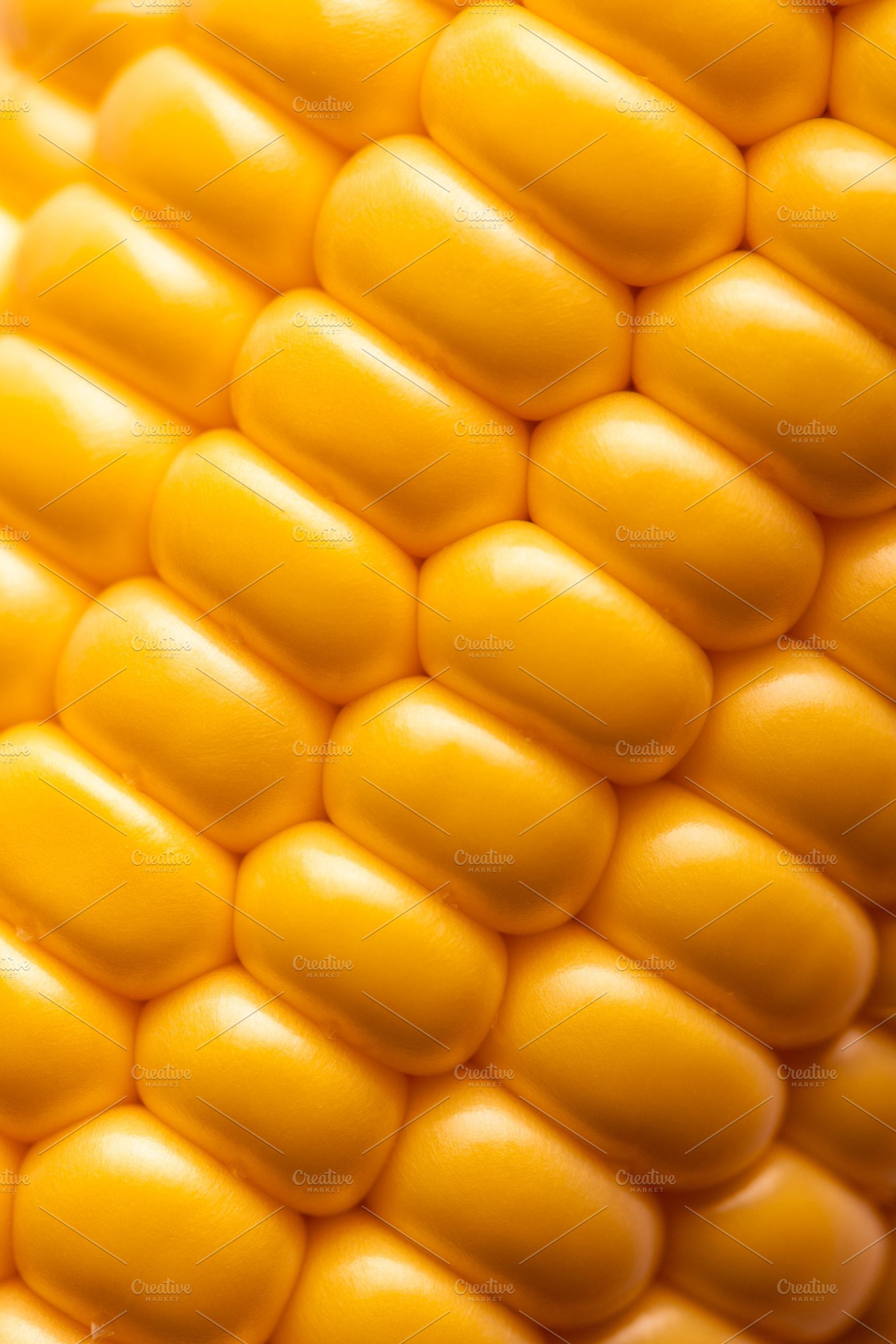 Extreme close-up of yellow corn kernels showing natural pattern, a Food & Drink Photo by Ales Munt