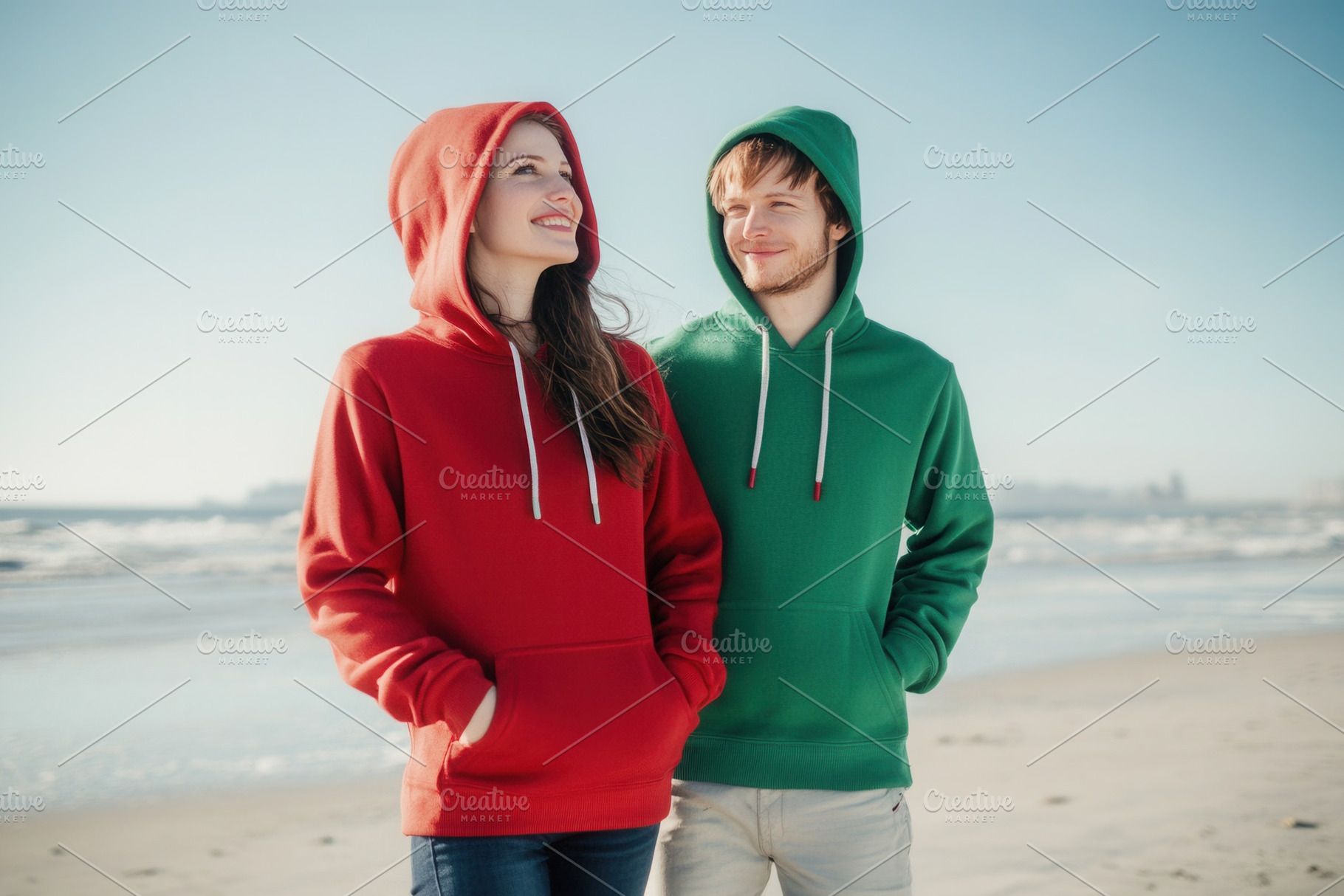 Man & woman in red and green hoodies, a Photo by Pavel_design