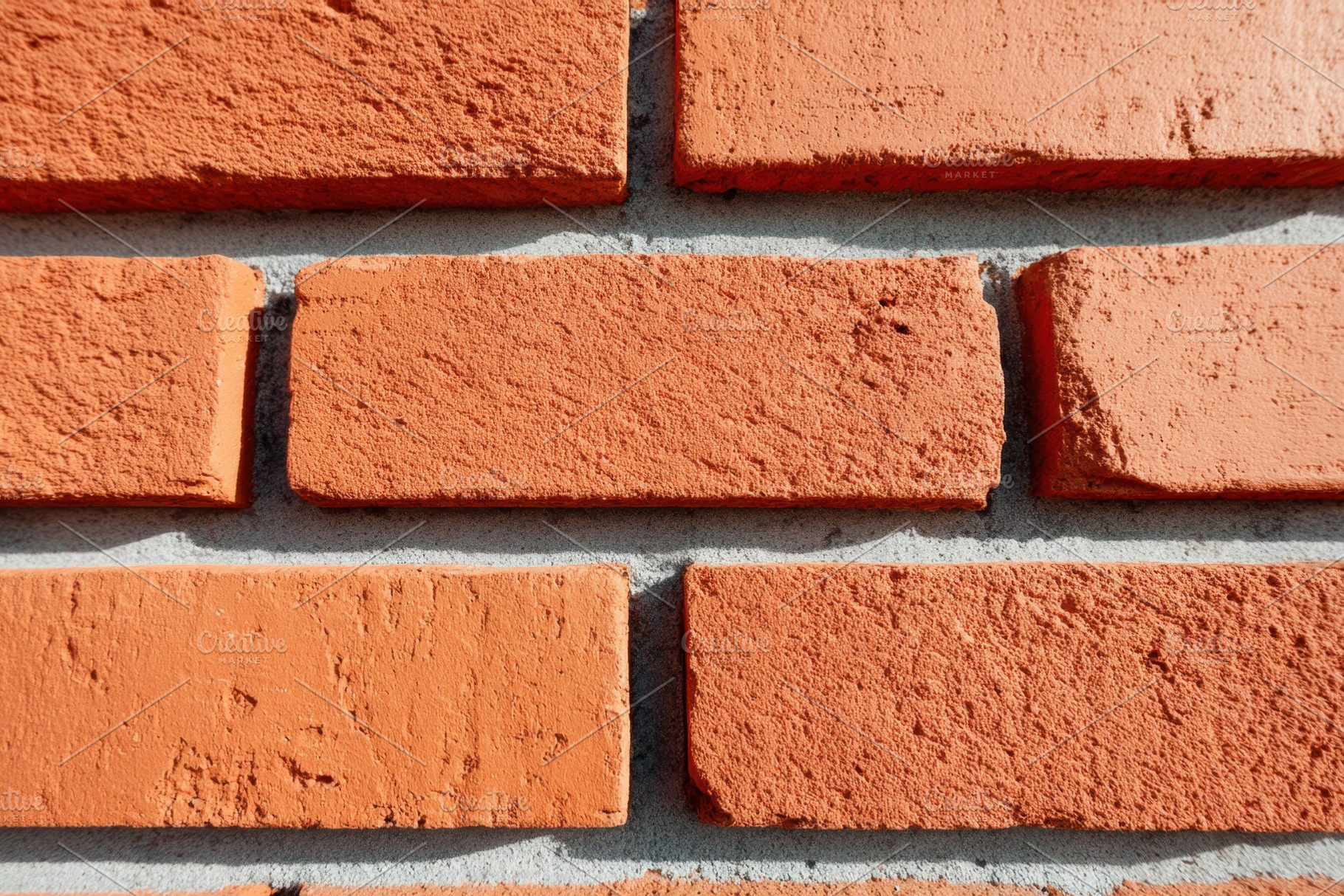 Textured brick wall close-up, a Background Photo by AlyaAnd