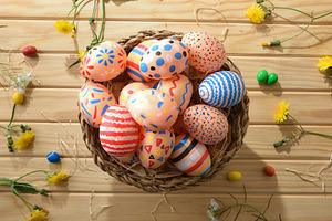 Colorful Easter Eggs in Rustic Wicker Basket, a Holiday Photo by Davizro's Market