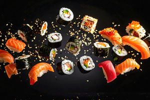 Flying sushi assortment with rolls nigiri and sesame seeds, a Food & Drink Photo by GoodGoods