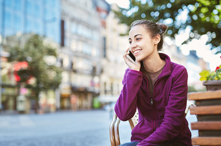 A woman tourist in the center of prague with a phone in the hands of, a Person Photo by vitaliymateha photography