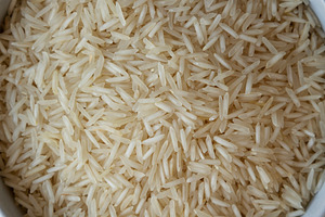 Uncooked White Organic Basmati Rice in a Bowl, top view. Close-u, a Food & Drink Photo by LiudmylaChuhunova