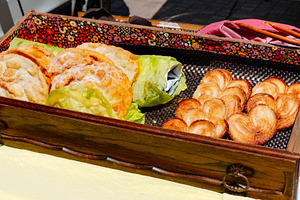french bougnettes and palmieres on display, a Photo by Nito
